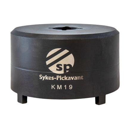 A black metal socket tool with the Sykes-Pickavant KM19 model label on it.