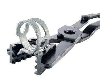 action shot of double x hose clamp pliers  holding a hose clamp